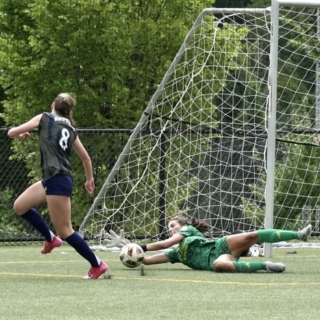 Aviana Owings diving to make a save