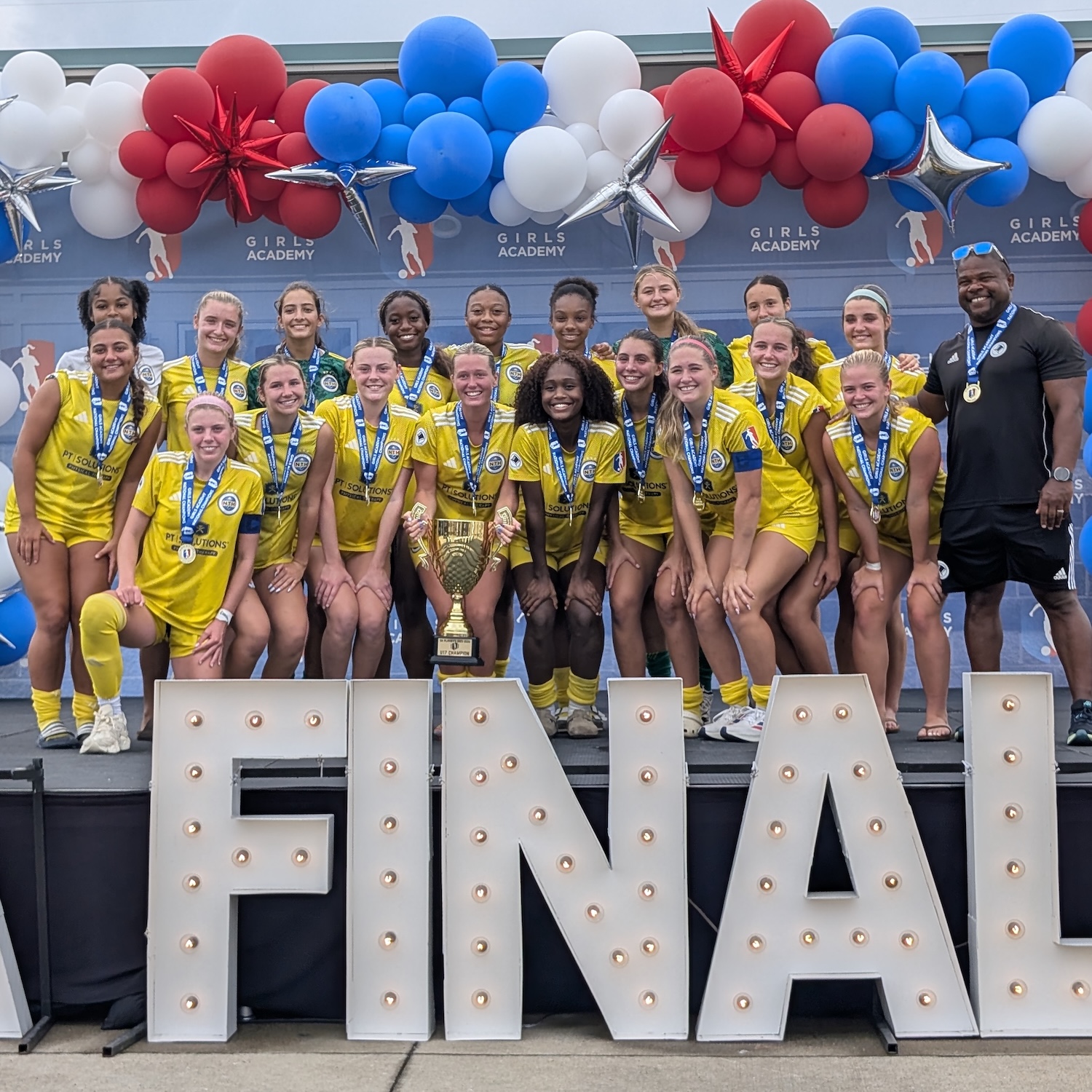 TopHat Gold celebrating with the Girls Academy League National Championship trophy